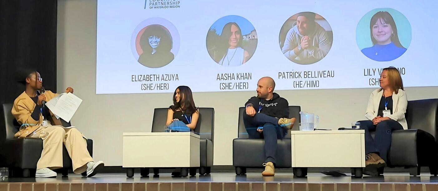 A picture of Liz moderating a panel discussion